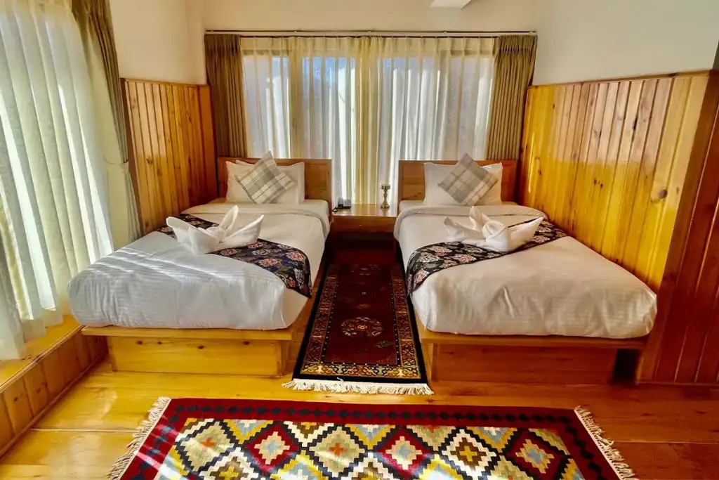 Twin Room with two single beds and a Bhutanese rug