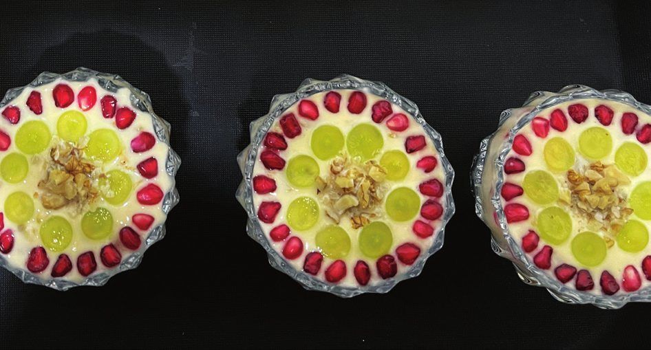 Desserts topped with farm fruit and pomegranate seeds