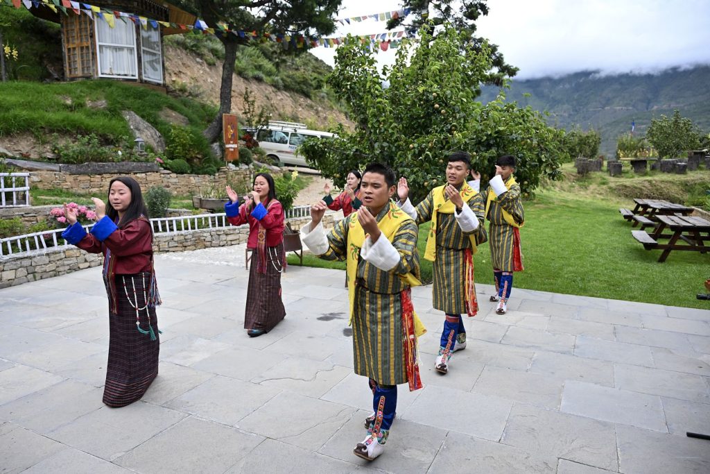 Folk dancers in traditional dress in the courtyard