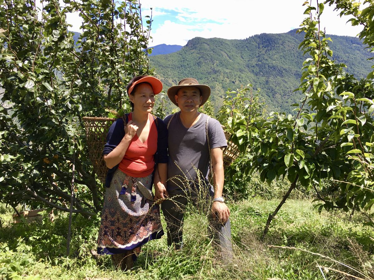 Our two founders, Dorji and Kezang, in the orchard