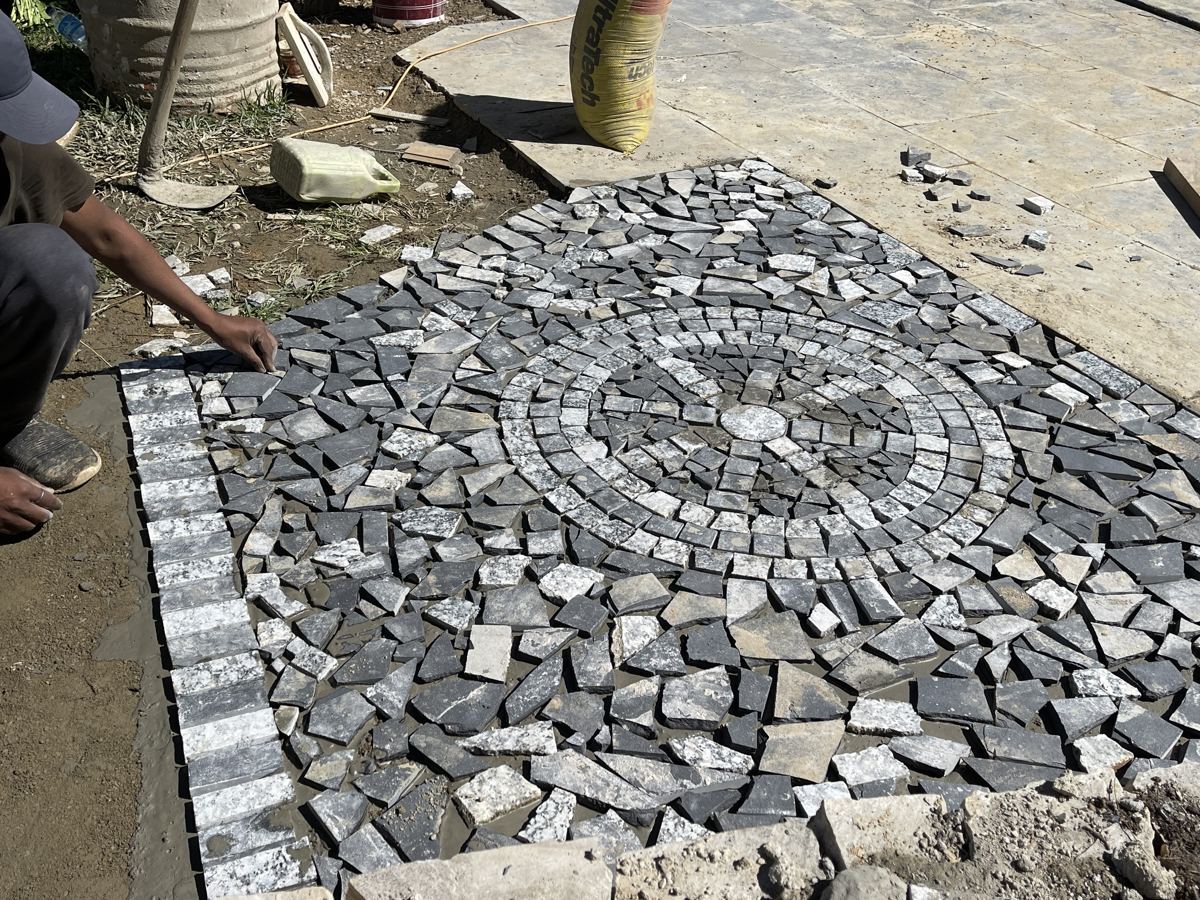 Building the stone mandala in the courtyard